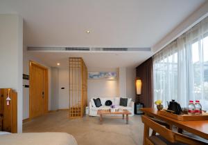 Uma área de estar em Wang Yun Residence Boutique Homestay Zhangjiajie