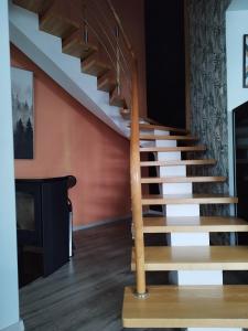a set of stairs in a living room at Pajūrio Brizo Kotedžas in Klaipėda