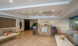 a lobby with a reception desk in a building at Treebo Trend Acsys - Gachibowli in Kondapur