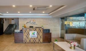 a lobby of a hotel with a reception desk at Treebo Trend Acsys - Gachibowli in Kondapur