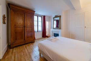 Tempat tidur dalam kamar di Home - Michelet - Séjour à Auxerre