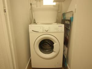 a washing machine in a small room with a window at Apartamento Roses, 1 dormitorio, 4 personas - ES-228-110 in Roses