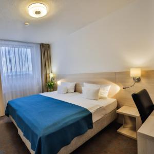 Posteľ alebo postele v izbe v ubytovaní Hotel Metropol