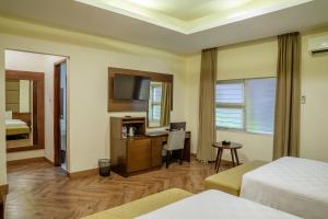 Postel nebo postele na pokoji v ubytování Hotel Alia Cikini