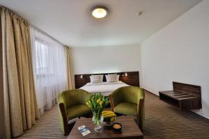 Posteľ alebo postele v izbe v ubytovaní Hotel Metropol