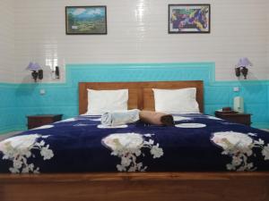 Postel nebo postele na pokoji v ubytování Grace Paradise Guest House
