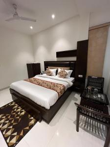 a bedroom with a large bed in a room at Hotel SB Residency in Amritsar
