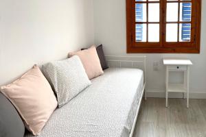Cama ou camas em um quarto em Apartamentos Vela Blanca