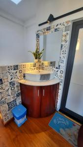 a bathroom with a sink and a mirror at Homestay Lucas's House in Liên Trì (3)