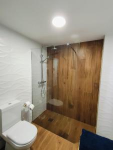 a bathroom with a toilet and a shower at Sea you soon apartment. Lloret de Mar city center in Lloret de Mar