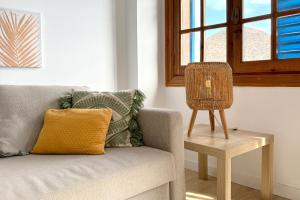 Uma área de estar em Apartamentos Vela Blanca