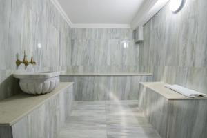 a bathroom with a sink and a counter at EÖB TAKSİM HOTEL in Trabzon