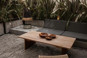 a coffee table in a living room with a couch at @before sunset in Çeşme