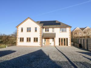an image of a house with solar panels on it at Devon House in Holsworthy