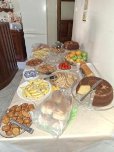 a table topped with lots of different types of food at Residencial Vitoria in Ponta do Sol