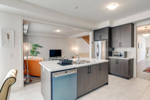 a kitchen with a sink and a refrigerator at Beautiful oasis in Midhurst