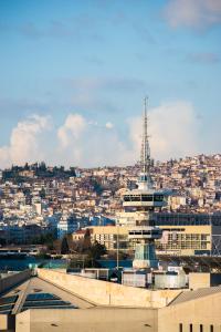a view of a city with a building and a tower at Heaven on the 7th in Thessaloniki +70 photos