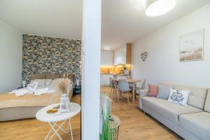 Posteľ alebo postele v izbe v ubytovaní Horyzont Apartamenty - Kapitański Mostek- BLISKO PORTU- Śniadania