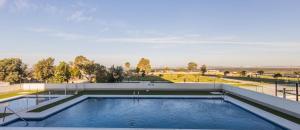 a swimming pool on the roof of a building at Torres de la caseria con piscina in San Fernando