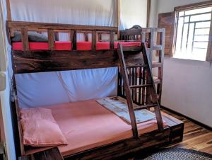 a couple of bunk beds in a room at La maison d'hôte de la Forêt Retrouvée in Mahajanga