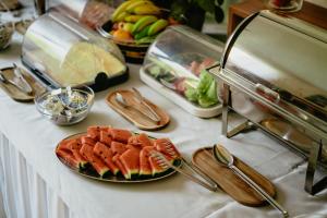 a table topped with plates of food on a counter at Amantis Vital Sport Hotel in Desná