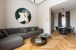 a living room with a couch and a table at San Martino - Luxury Apartments By Design Club Collection in Bologna