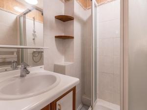 a white bathroom with a sink and a shower at Studio 3*** aux pistes, cheminée, animaux admis, garage - FR-1-304-111 in La Clusaz