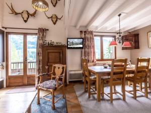 a dining room with a table and chairs at Appartement La Clusaz, 4 pièces, 6 personnes - FR-1-304-214 in La Clusaz
