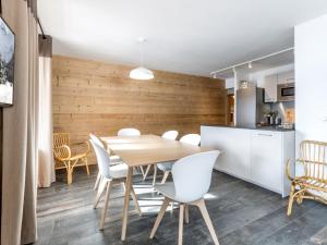 a kitchen and dining room with a table and chairs at Appartement La Clusaz, 4 pièces, 8 personnes - FR-1-304-205 in La Clusaz