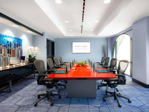 a conference room with a long table and chairs at Hotel Sofitel Los Angeles at Beverly Hills in Los Angeles