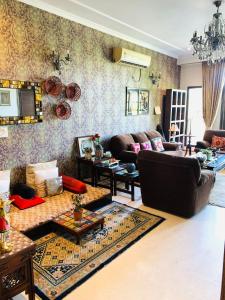 a living room with a couch and a table at Vandana's Bed and breakfast in New Delhi