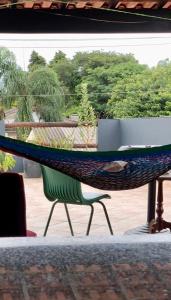 a hammock sitting on top of a chair at RustiCidade in Sao Paulo