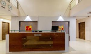 a lobby with a reception desk in a building at Treebo Trend Eco Stay T Nagar in Chennai