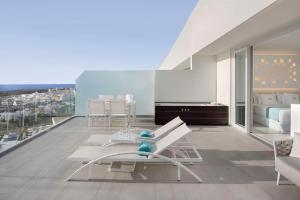 a living room with a view of a city at Royal Hideaway Corales Suites in Adeje