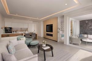 a living room with a couch and a table at Royal Hideaway Corales Suites in Adeje