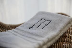 a napkin with the number on it sitting on a basket at Verde Acqua - Design & Comfort in Milan