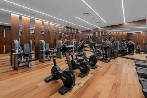a gym with a row of treadmills and ellipticals at Royal Hideaway Corales Beach - Adults Only in Adeje