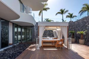 an external view of a house with a bedroom at Royal Hideaway Corales Beach - Adults Only in Adeje