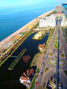 an aerial view of a city with a river at Delux Sea View Aparthotel in Orbi City Batumi in Batumi