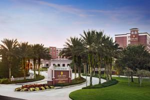 a rendering of a resort with palm trees and a sign at Caribe Royale Orlando in Orlando