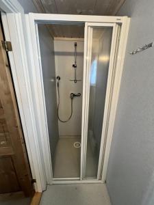 a shower with a glass door in a bathroom at Granebo - Ustaoset in Ustaoset