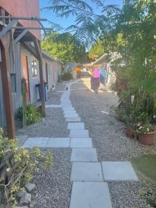 a woman walking down a path in a yard at valle in Copiapó