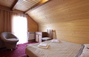 En eller flere senge i et værelse på Котедж "Гірський Краєвид"