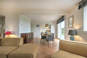 a living room with a couch and a table at Large contemporary pavilion on a hill overlooking Amboise and its château in Amboise