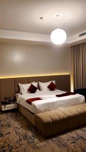 Postel nebo postele na pokoji v ubytování فندق جولدن نيو قريش - Golden New Quraish Jeddah-شركة الذهبية العصرية الفندقية