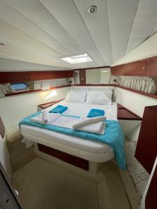 a large bed in the back of a boat at Luxury Living on a Yacht in Mikonos