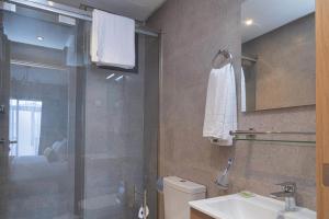a bathroom with a shower and a toilet and a sink at Rent-inn Boutique Hotel in Rabat +41 photos