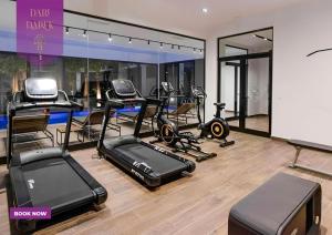 a gym with several exercise equipment in a room at Private Paradise in Tunisia : Apartment with Pool & Gym in Sidi Daoud