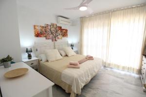 Una cama o camas en una habitación de Lunamar El mejor Resort en la mejor Playa