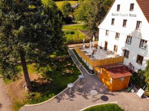 an aerial view of a white building with a courtyard at Gasthaus Krone Holzschlag in Bonndorf im Schwarzwald